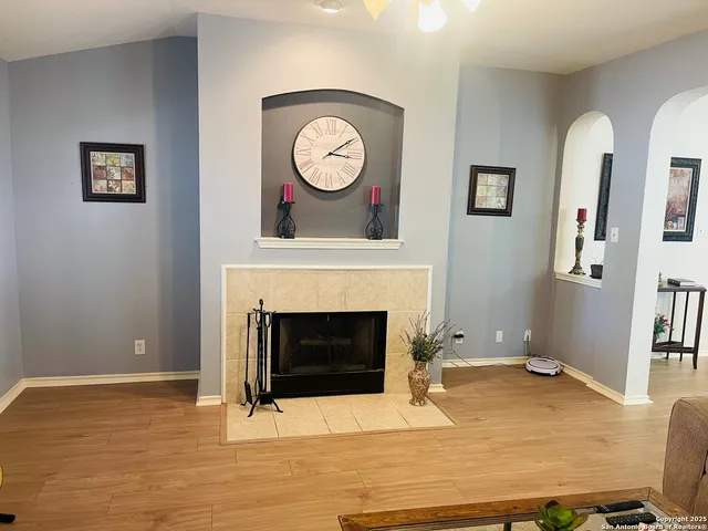 a view of a livingroom with furniture and a fireplace