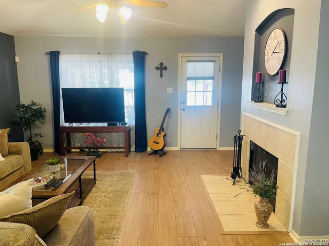 a living room with furniture and a flat screen tv
