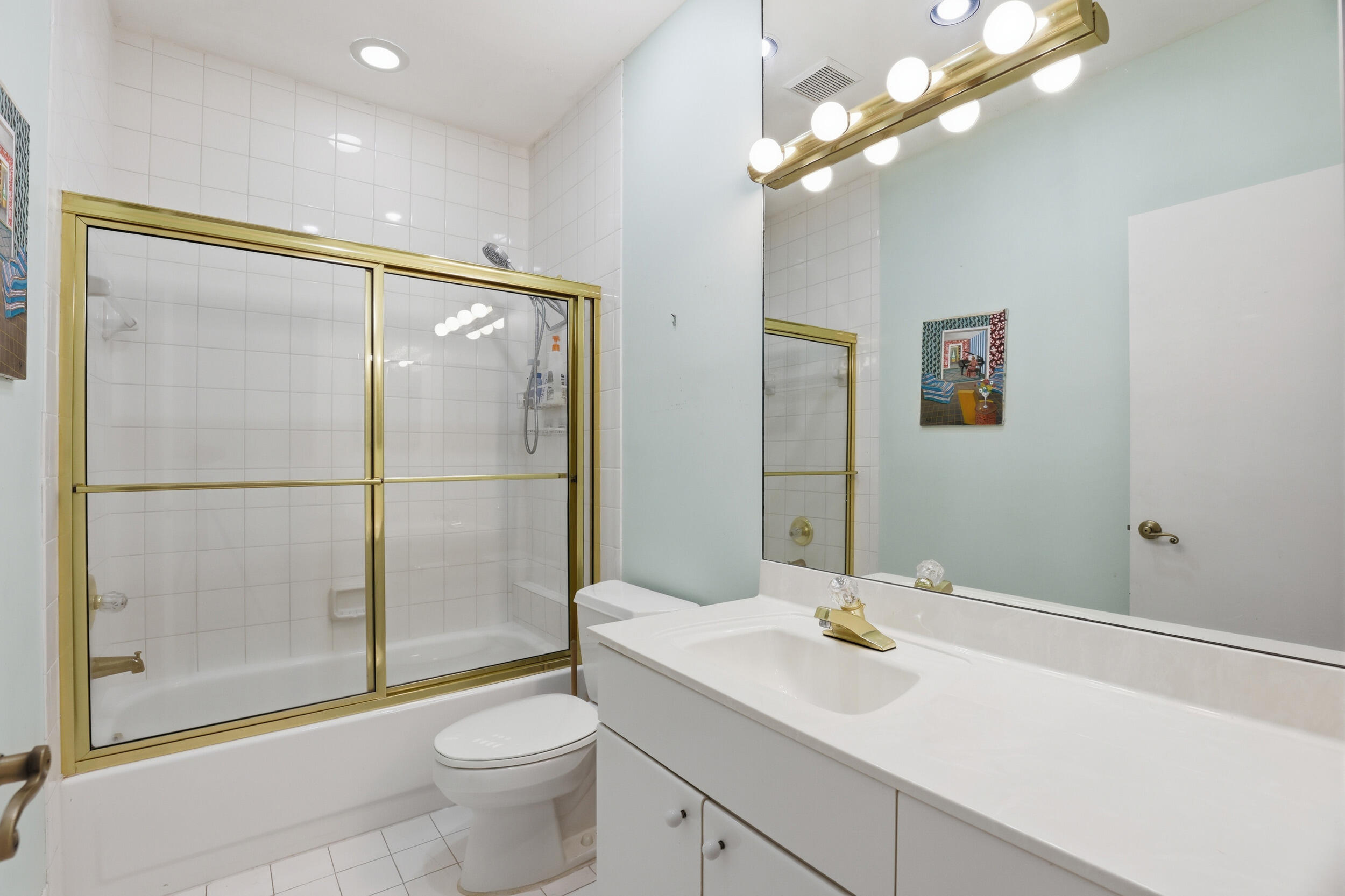 2248 Northwest 60th Street Boca Raton, FL 33496 - Photo 38 of 70 a bathroom with a sink a toilet and shower