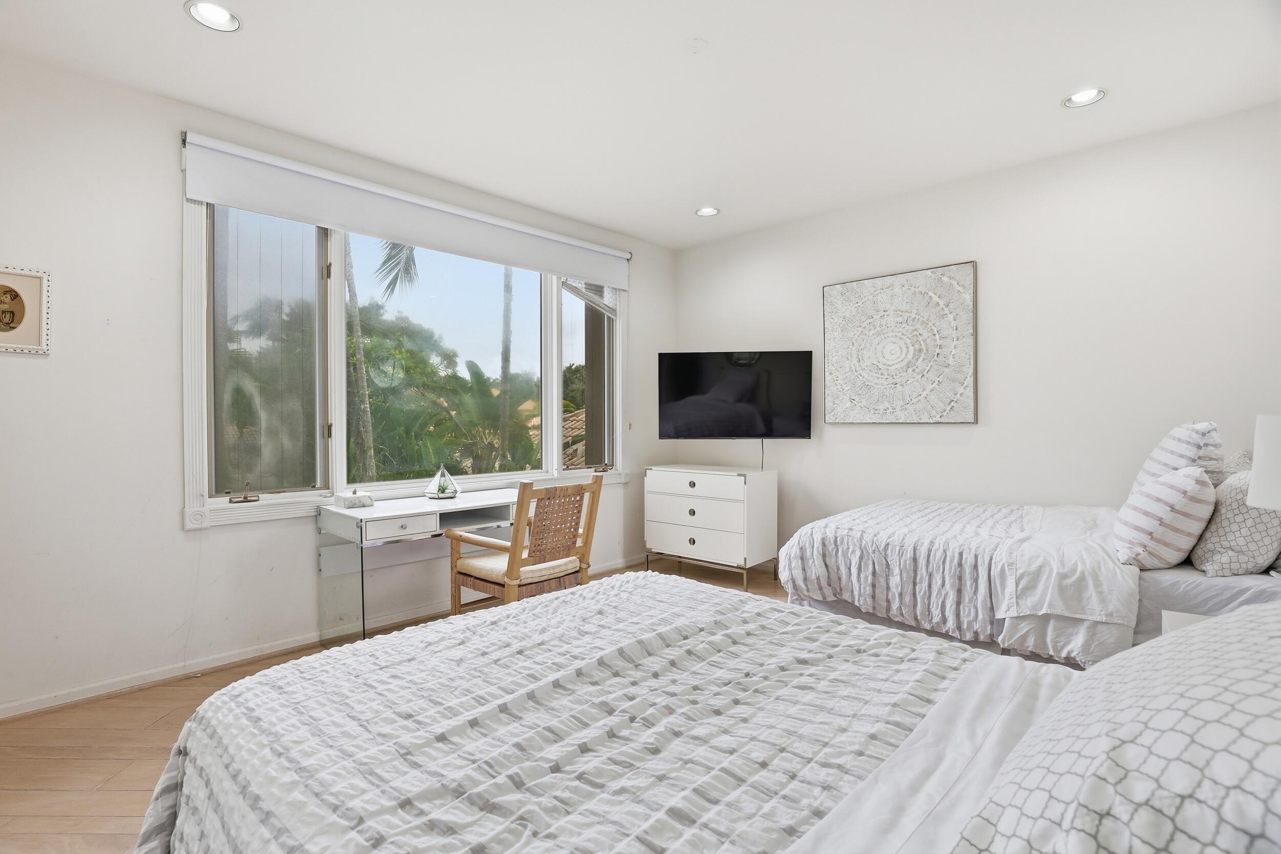 2248 Northwest 60th Street Boca Raton, FL 33496 - Photo 40 of 70 a bedroom with a bed and a flat screen tv