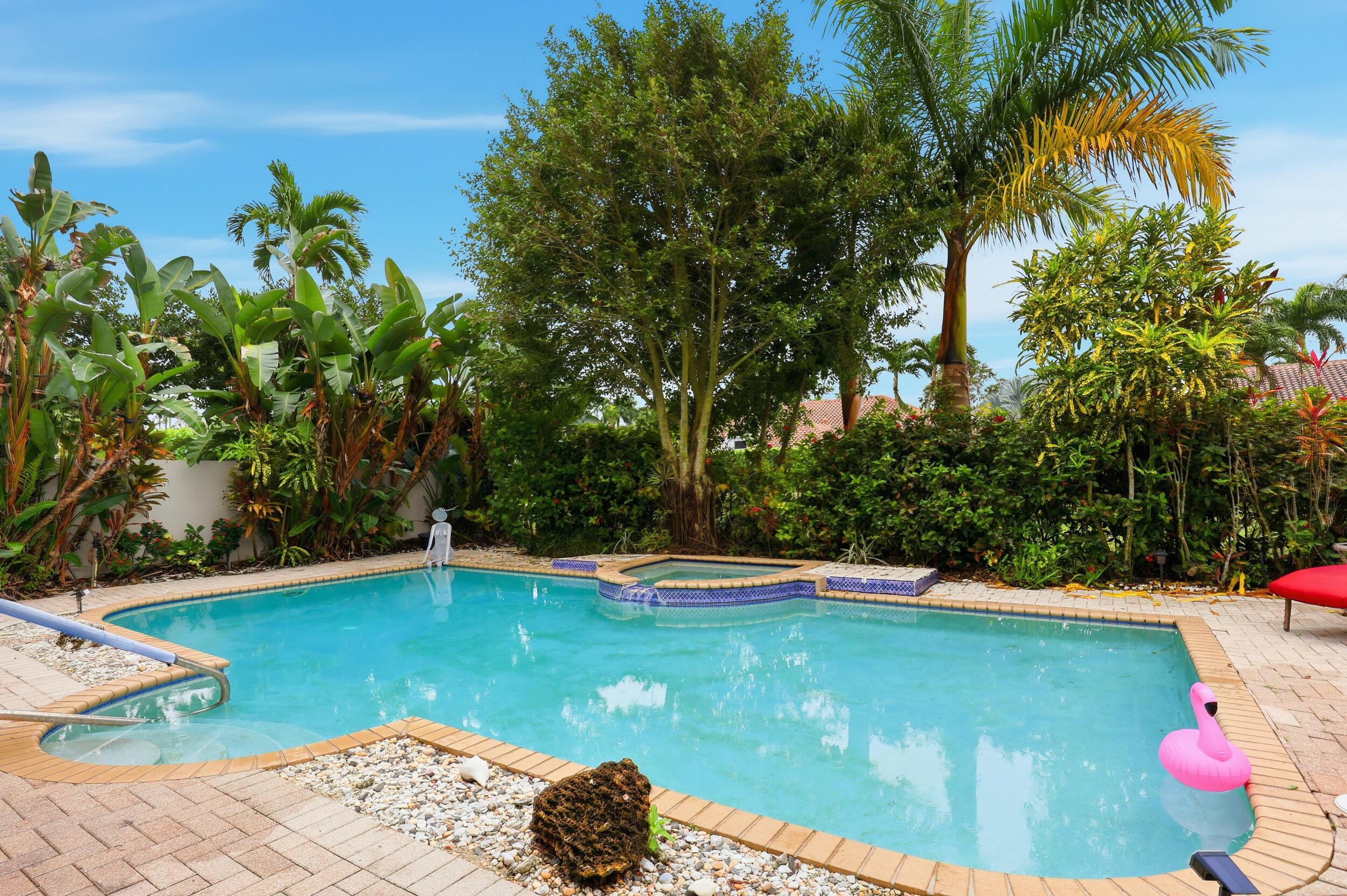 2248 Northwest 60th Street Boca Raton, FL 33496 - Photo 49 of 70 a view of a swimming pool with an outdoor space