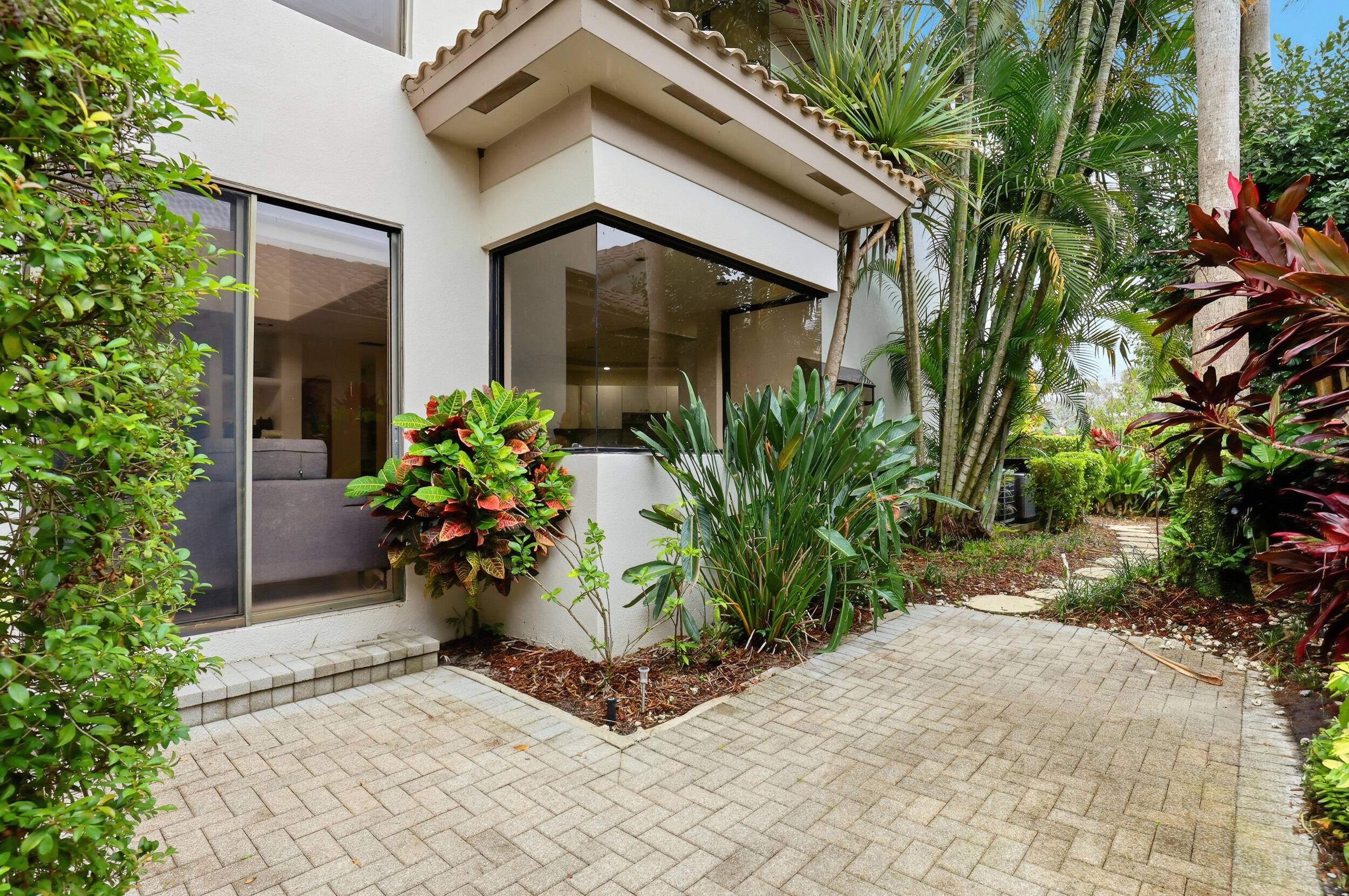 2248 Northwest 60th Street Boca Raton, FL 33496 - Photo 55 of 70 a front view of a house with a yard