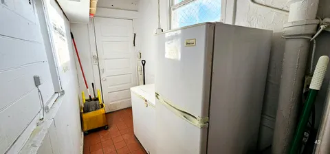 a bathroom with a double vanity sink a mirror and a shower