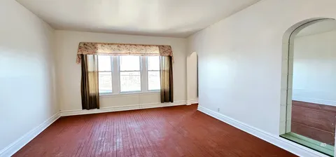 a view of a backyard with sitting area