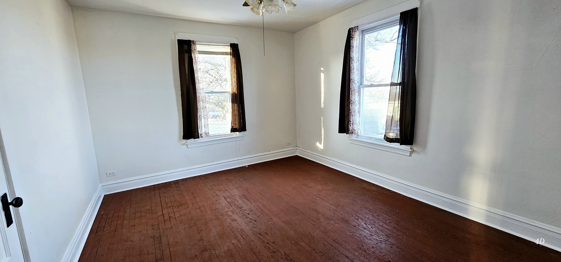 7400 Archer Road, Unit 7400 Justice, IL 60458 - Photo 32 of 76 an empty room with wooden floor and windows