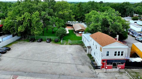 a backyard of a house with yard barbeque oven and outdoor seating