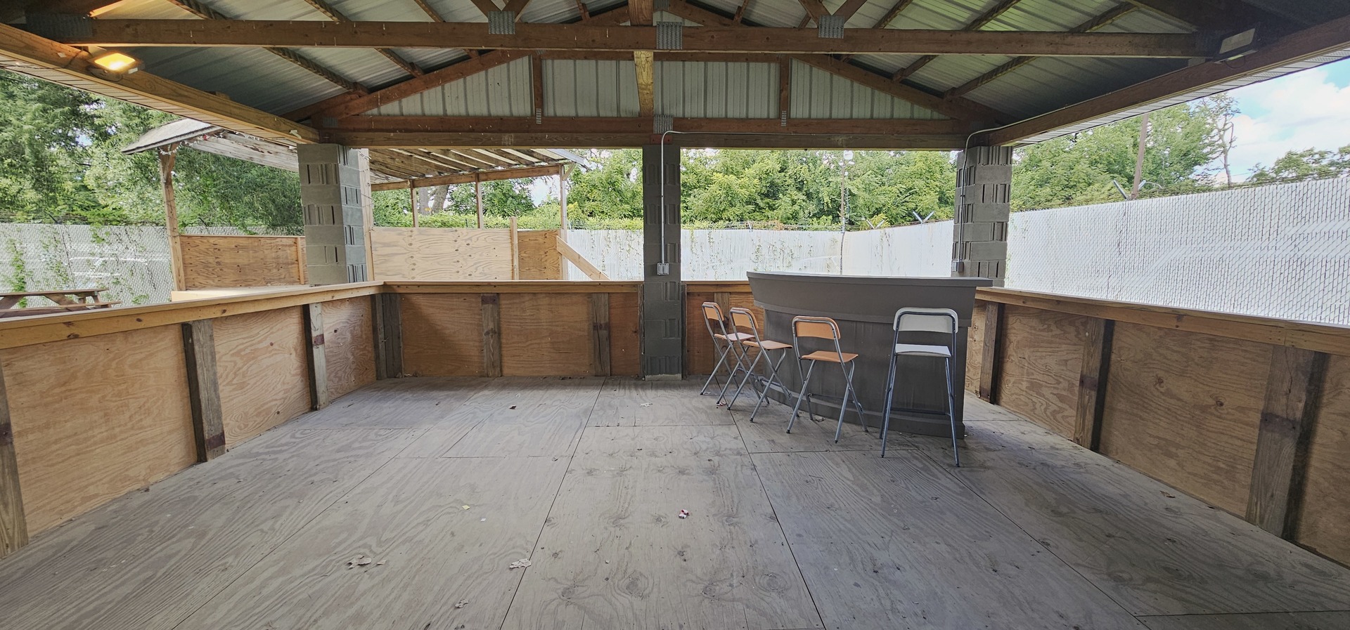 7400 Archer Road, Unit 7400 Justice, IL 60458 - Photo 41 of 76 a large white kitchen with wooden floor and outdoor seating