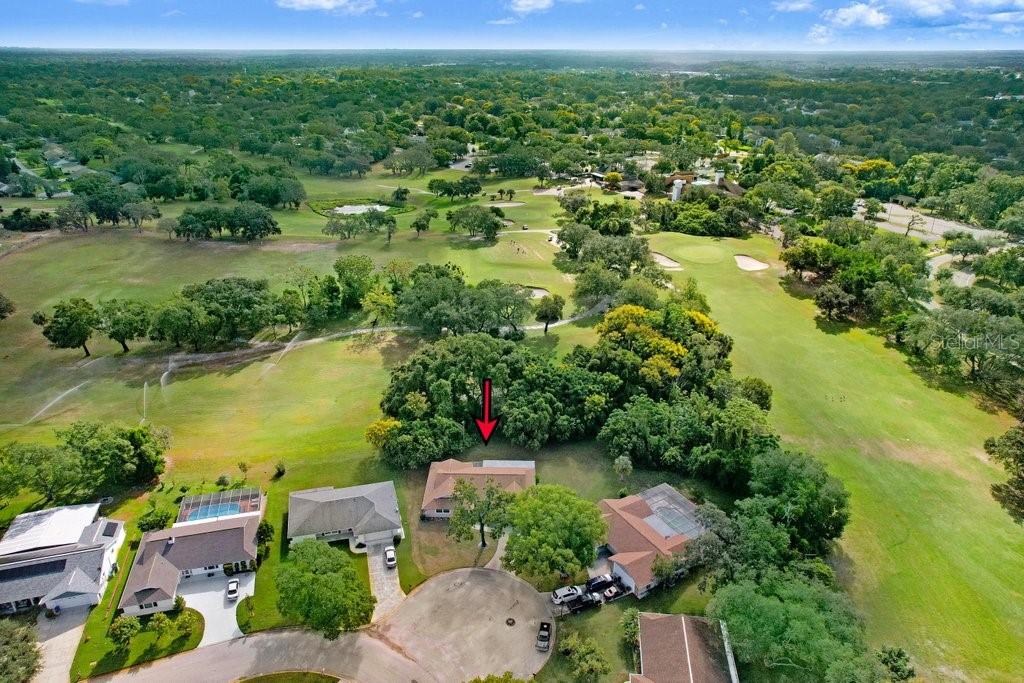 12600 Castleberry Court Bayonet Point, FL 34667 - Photo 18 of 52 an aerial view of residential houses with outdoor space and lake view