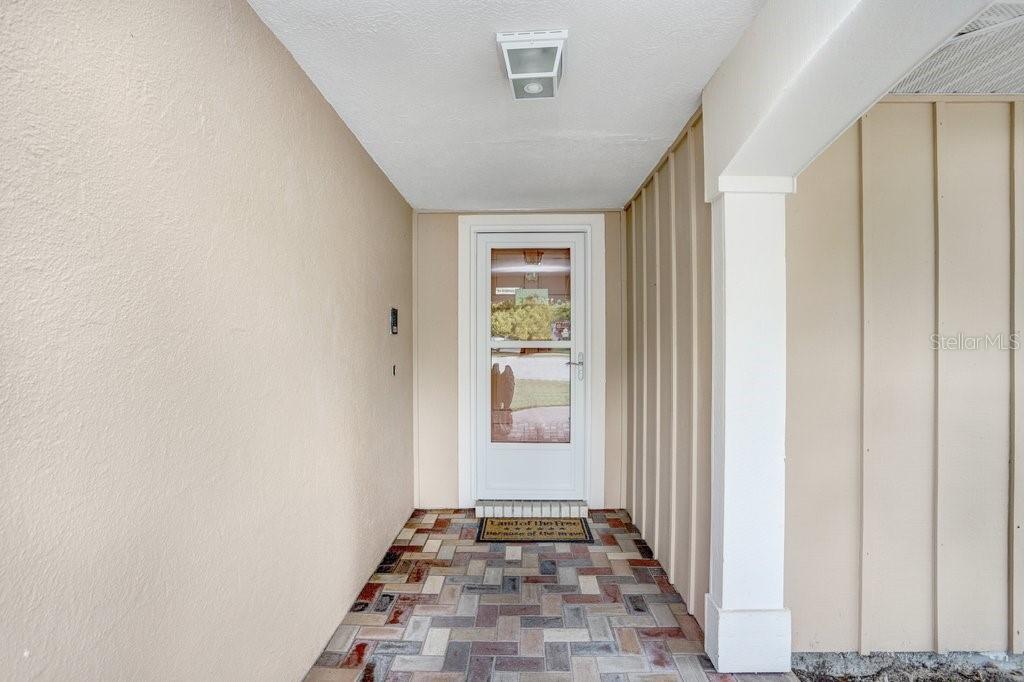 12600 Castleberry Court Bayonet Point, FL 34667 - Photo 19 of 52 a view of a hallway with windows