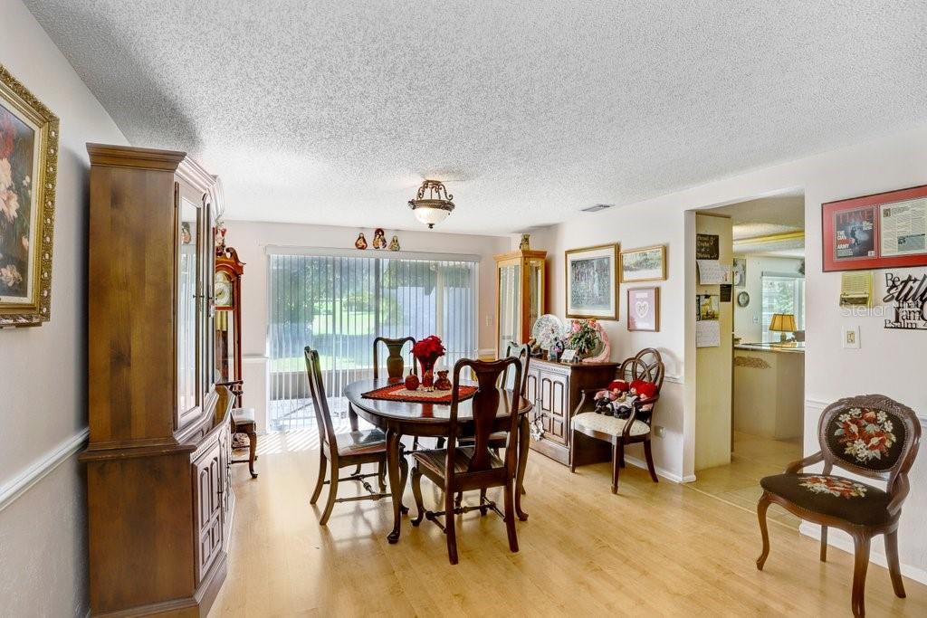 12600 Castleberry Court Bayonet Point, FL 34667 - Photo 23 of 52 a living room with furniture and a large window