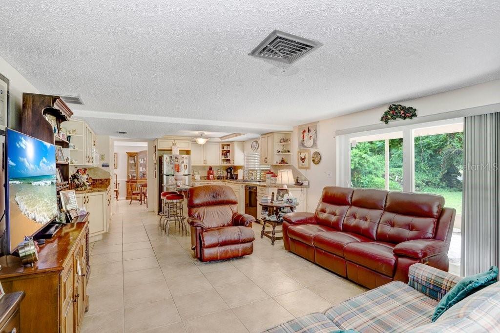 12600 Castleberry Court Bayonet Point, FL 34667 - Photo 27 of 52 a living room with furniture and a large window