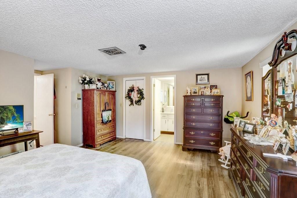 12600 Castleberry Court Bayonet Point, FL 34667 - Photo 32 of 52 a bedroom with a bed and a television