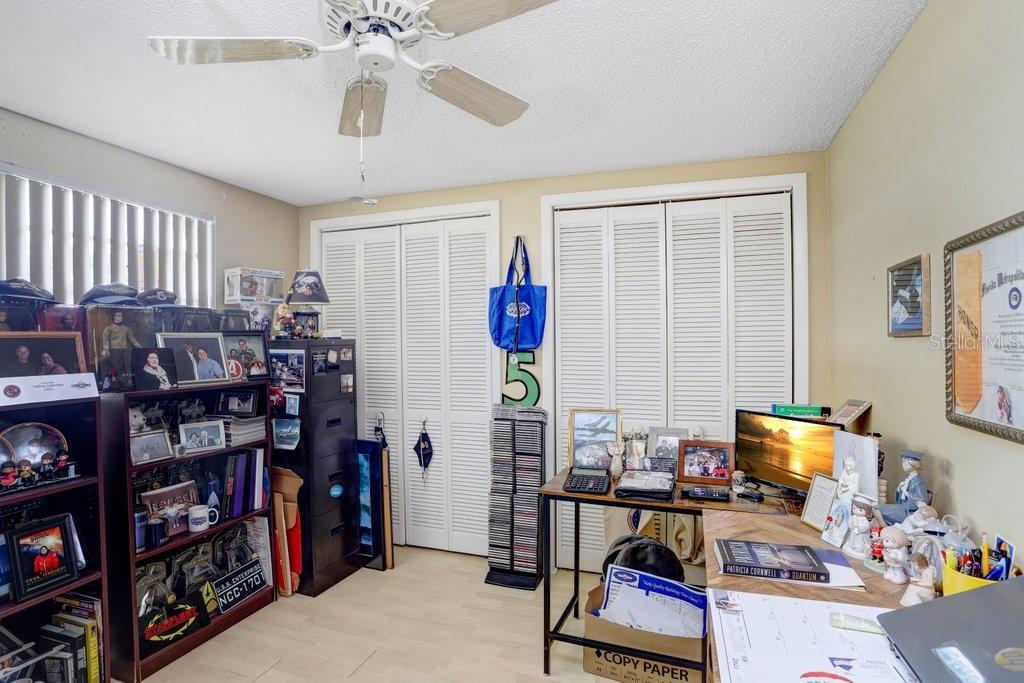 12600 Castleberry Court Bayonet Point, FL 34667 - Photo 36 of 52 a room with lots of books and more furniture