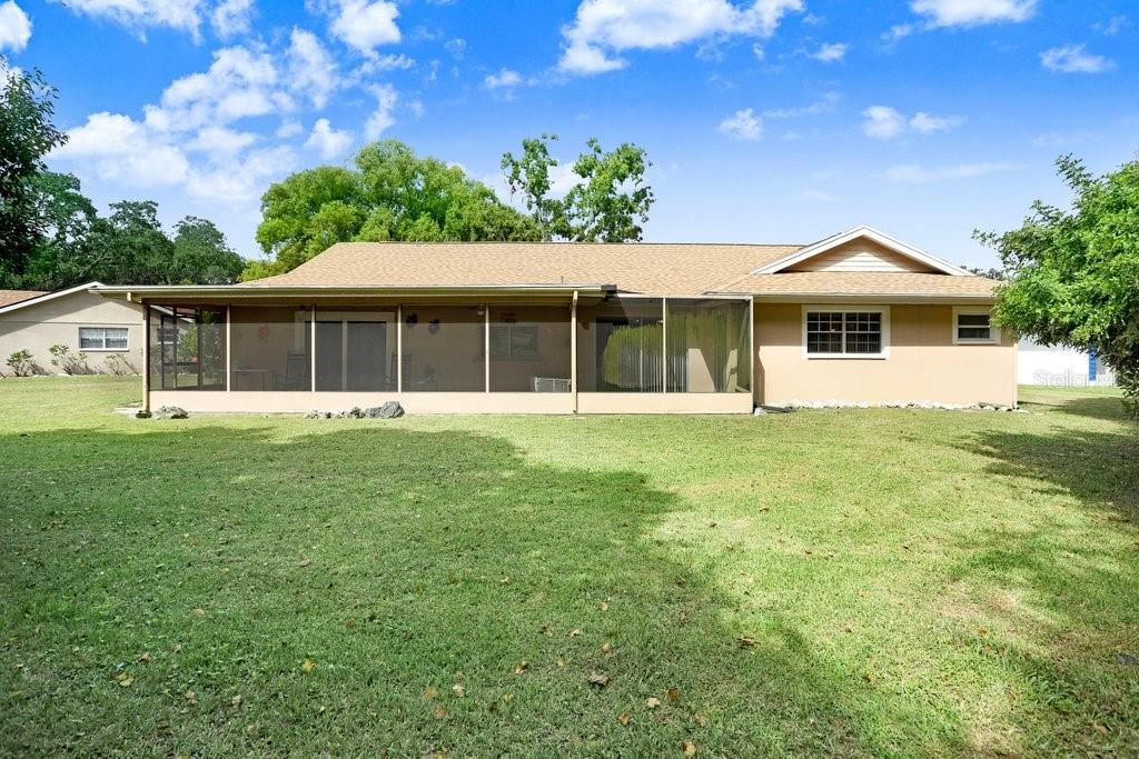 12600 Castleberry Court Bayonet Point, FL 34667 - Photo 41 of 52 a front view of a house with a yard