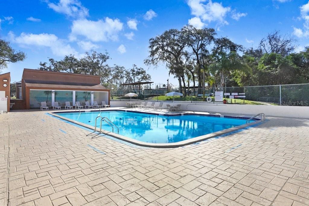 12600 Castleberry Court Bayonet Point, FL 34667 - Photo 44 of 52 a view of a house with swimming pool and sitting area