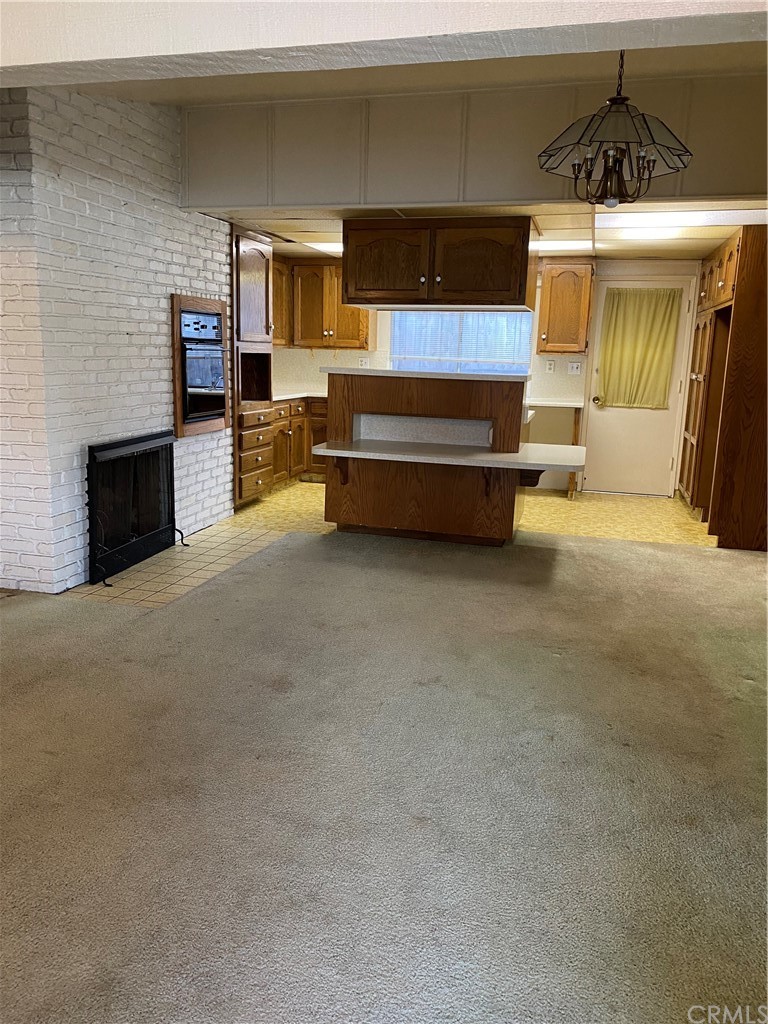 207 Hanover Drive Costa Mesa, CA 92626 - Photo 3 of 7 a living room with furniture and a fireplace
