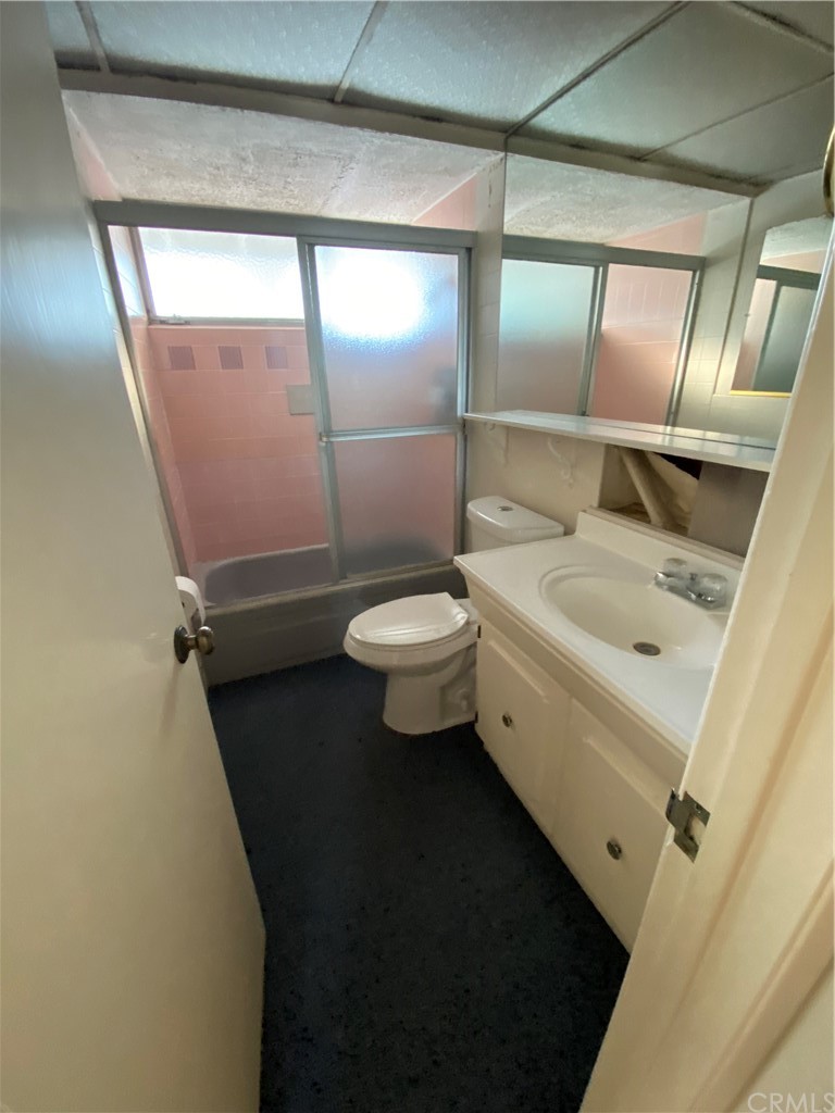 207 Hanover Drive Costa Mesa, CA 92626 - Photo 6 of 7 a bathroom with a sink a toilet and a mirror