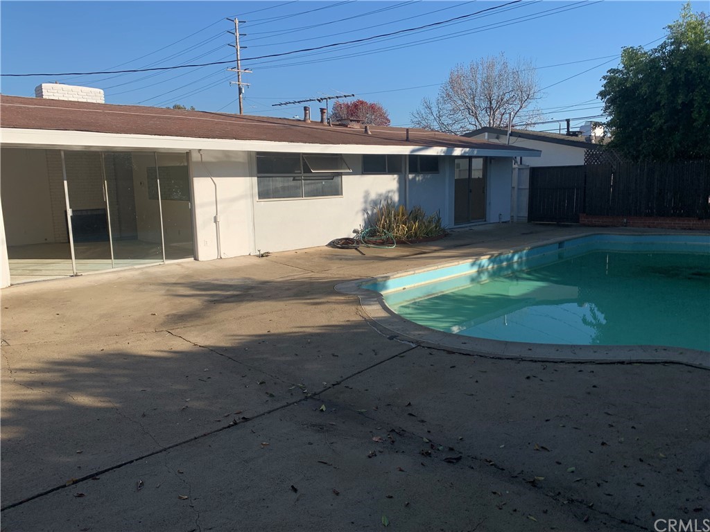 207 Hanover Drive Costa Mesa, CA 92626 - Photo 7 of 7 a view of a white house with a sink and yard