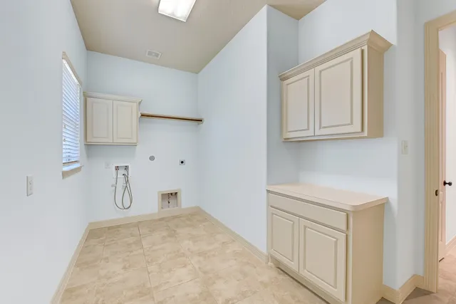 a room with cabinets and wooden floor