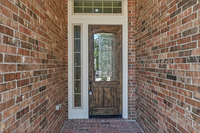 a view of a brick house with a door