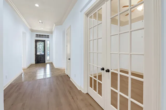 wooden floor with white walls