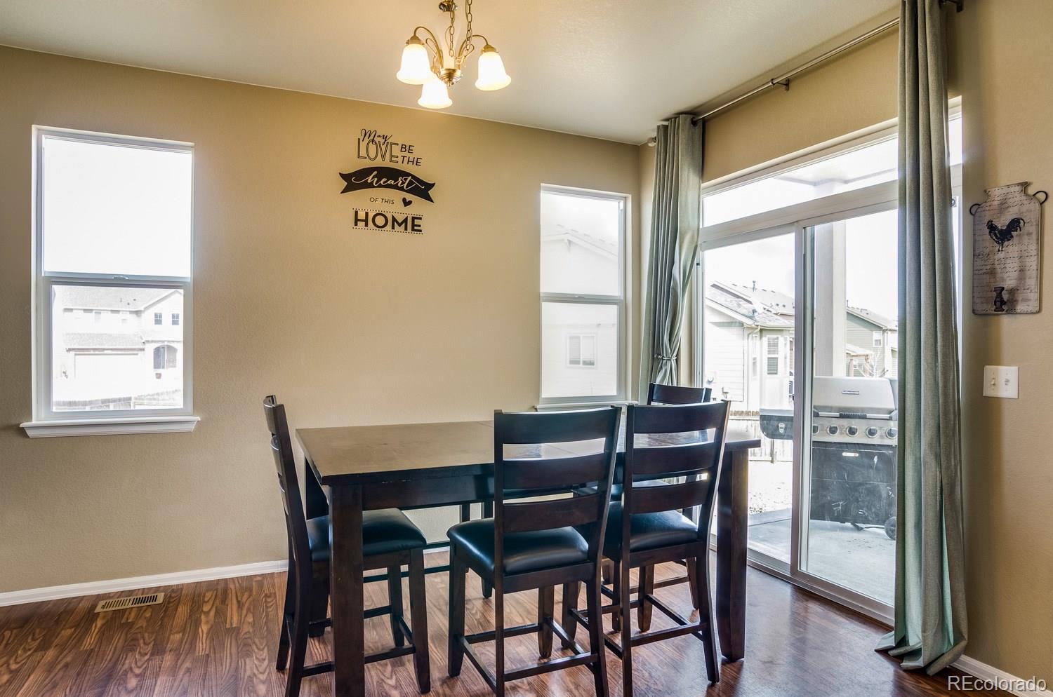 8582 Raspberry Drive Frederick, CO 80504 - Photo 8 of 28 a view of a dining room with furniture window and outside view