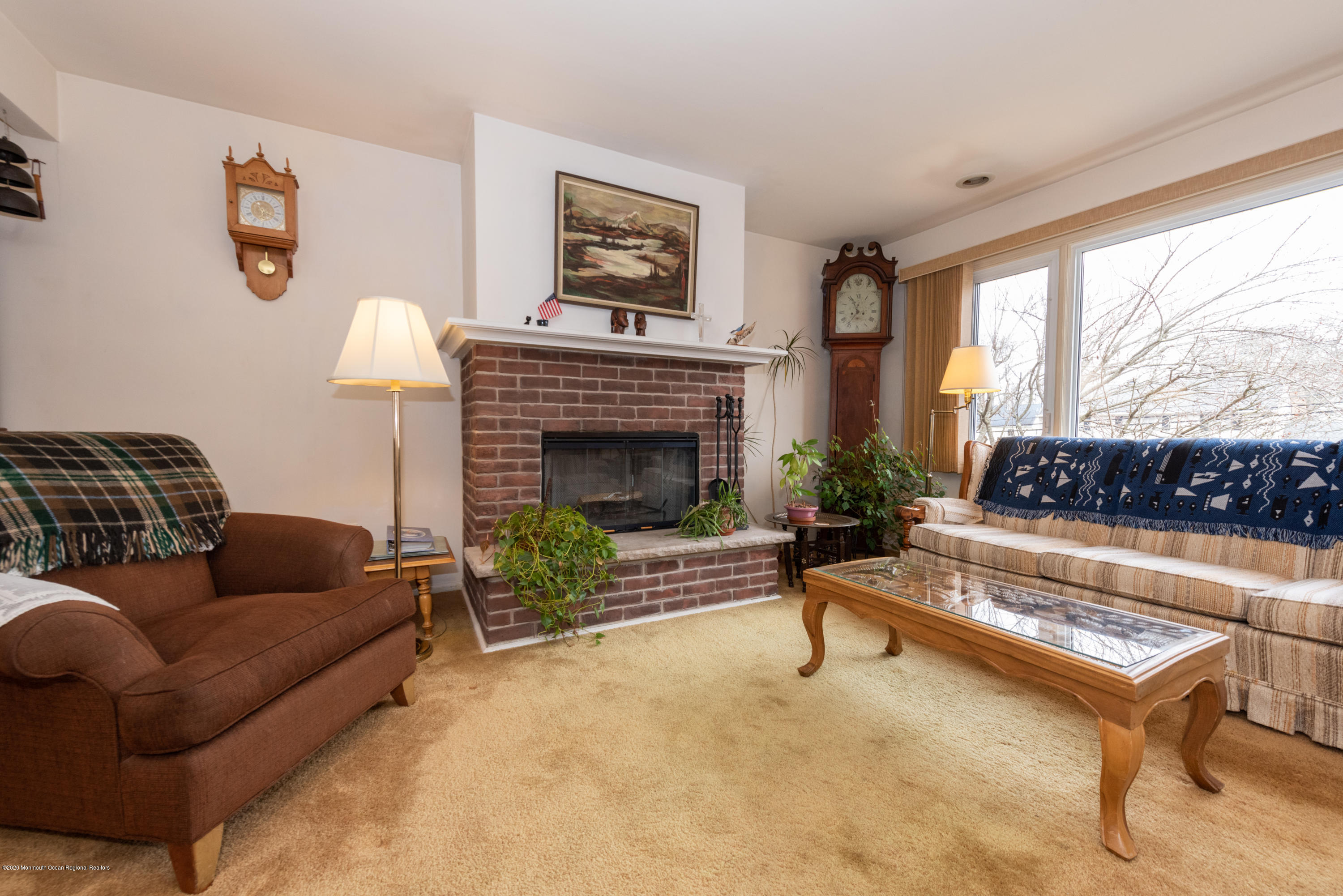 14 Branch Road Oakhurst, NJ 07755 - Photo 6 of 31 a living room with furniture and a fireplace