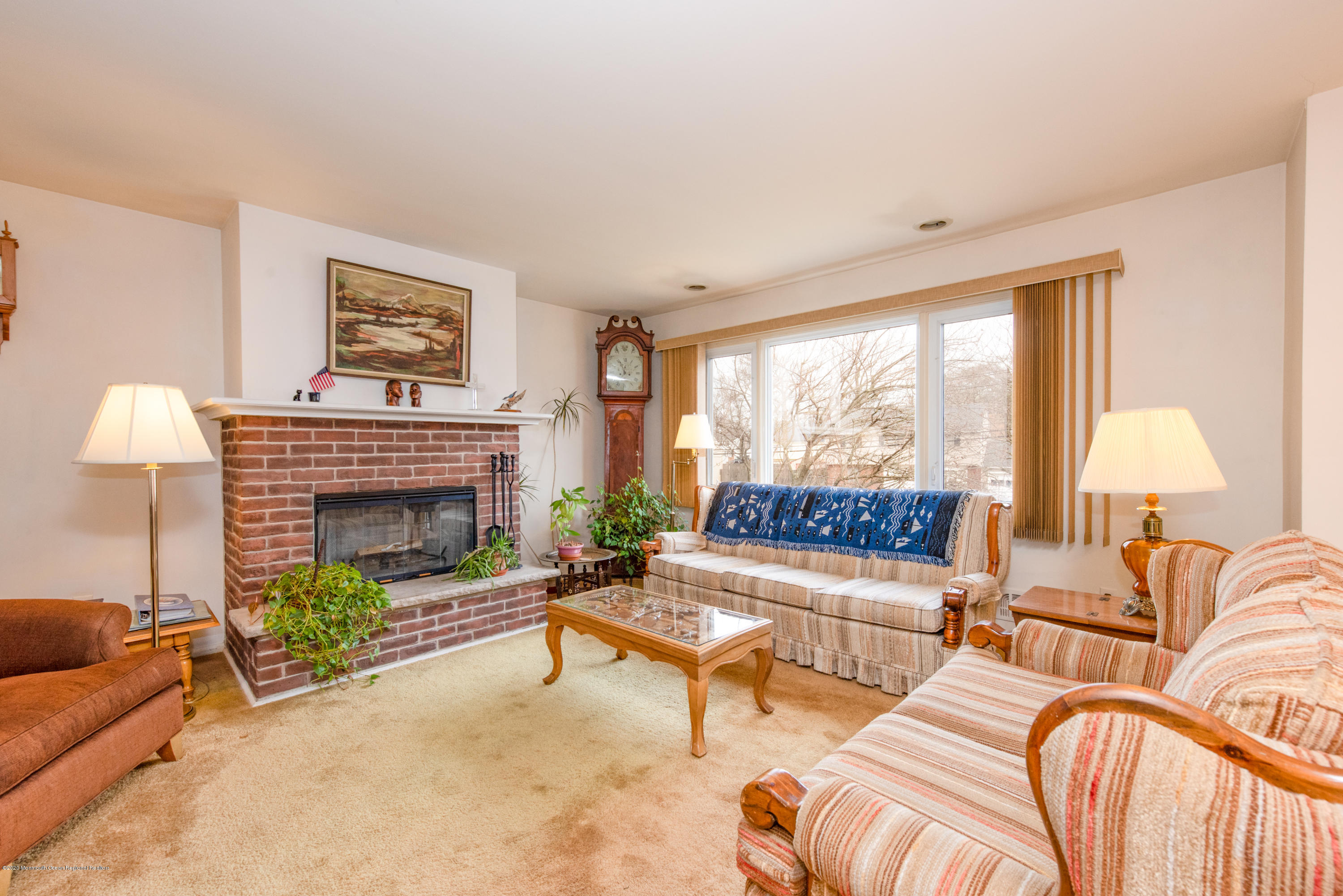 14 Branch Road Oakhurst, NJ 07755 - Photo 8 of 31 a living room with furniture and a fireplace
