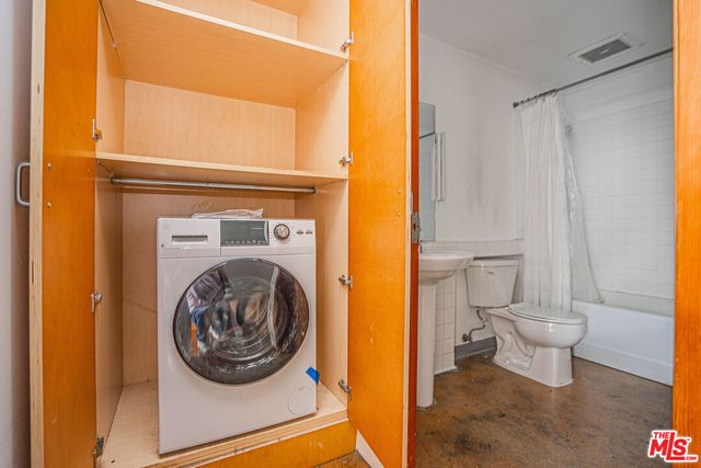 a bathroom with a toilet and a sink