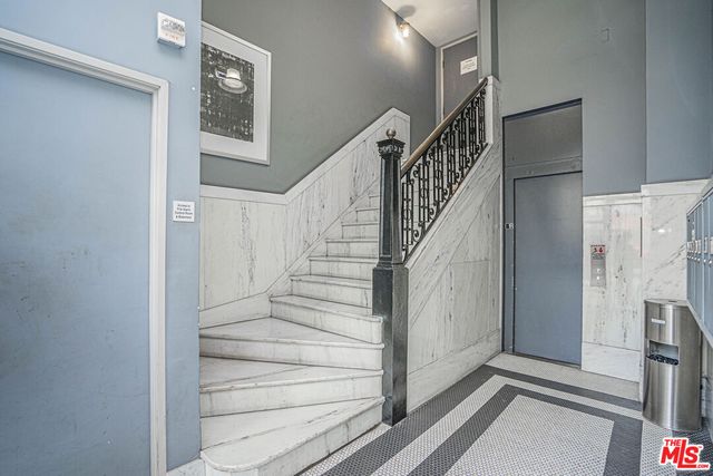 a view of entryway and hall with a front door