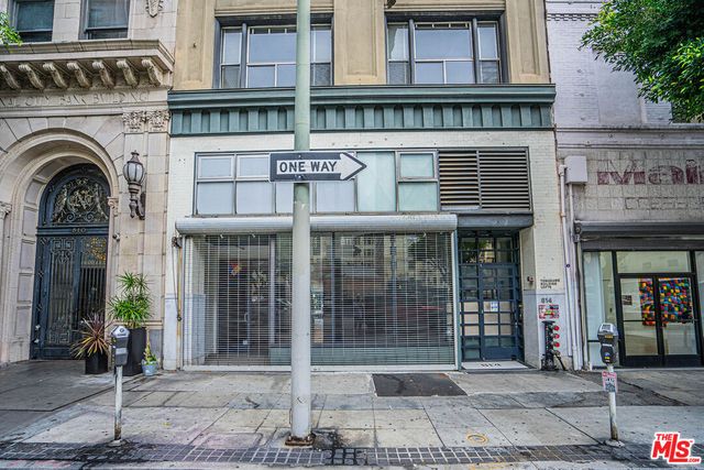 a view of a brick building with many windows