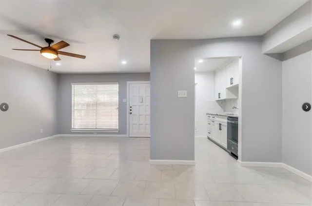 a view of a kitchen with a sink and a window