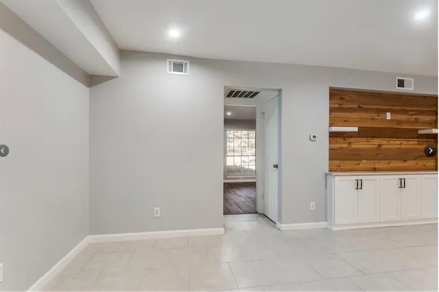 an empty room with cabinet