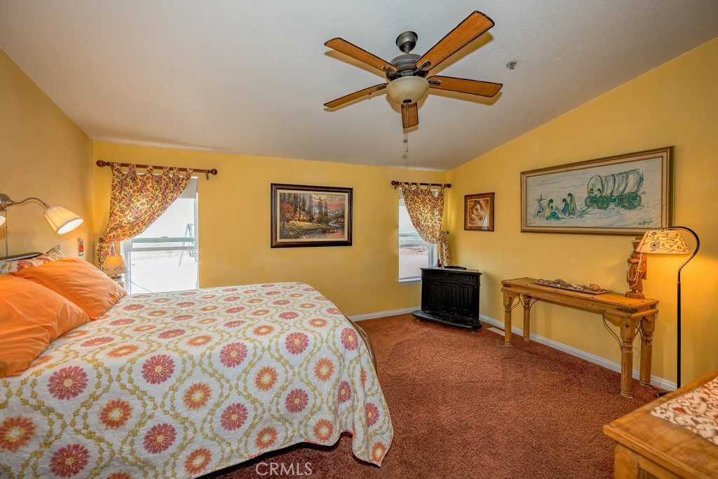33330 Palen Road Agua Dulce, CA 91390 - Photo 13 of 56 a bedroom with a bed and wooden floor