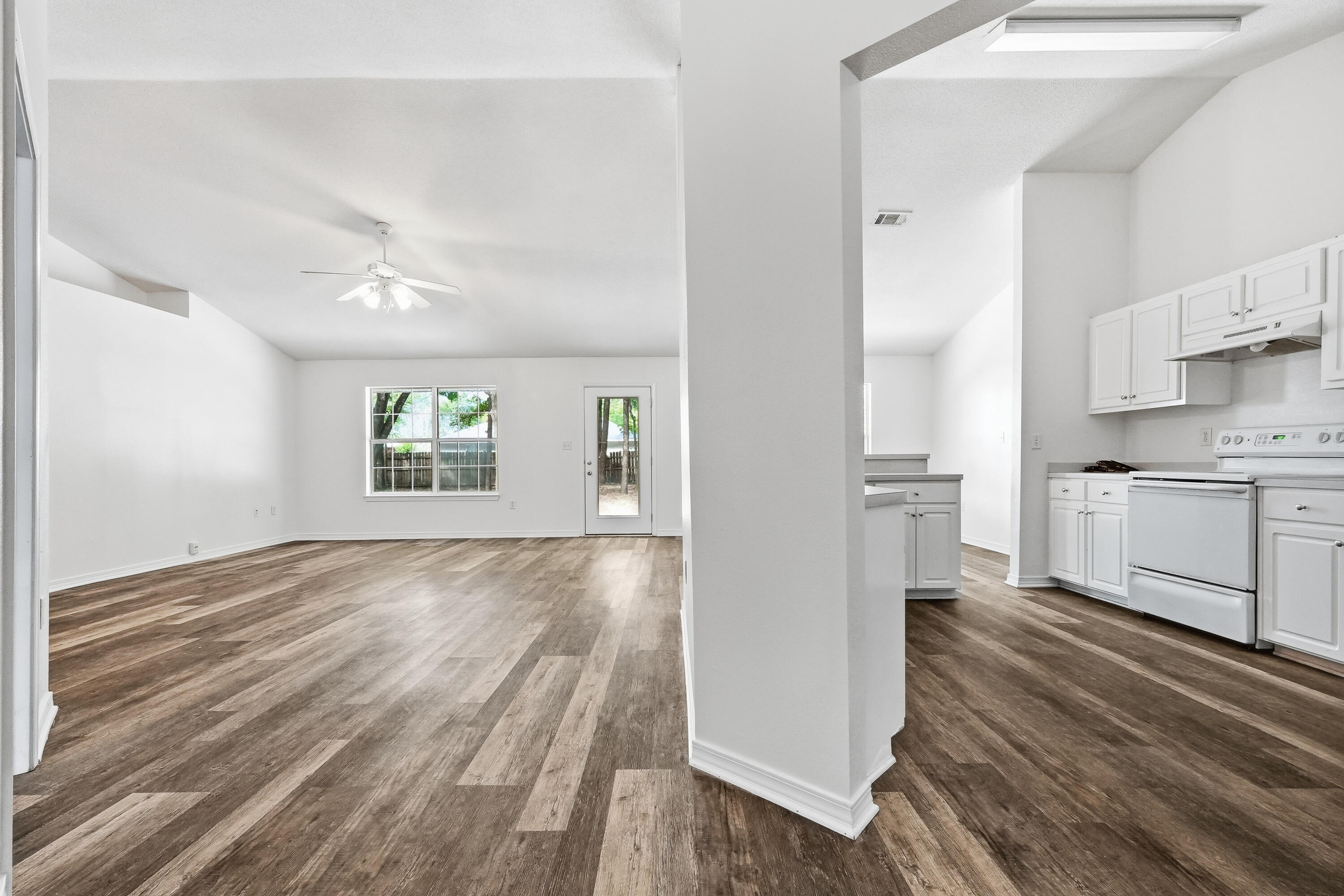 4087 Audiss Road Milton, FL 32583 - Photo 7 of 34 a view of kitchen and wooden floor