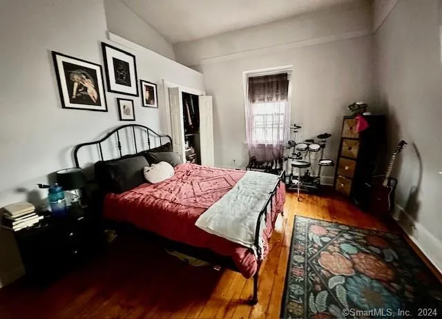 a bed room with a bed and dresser