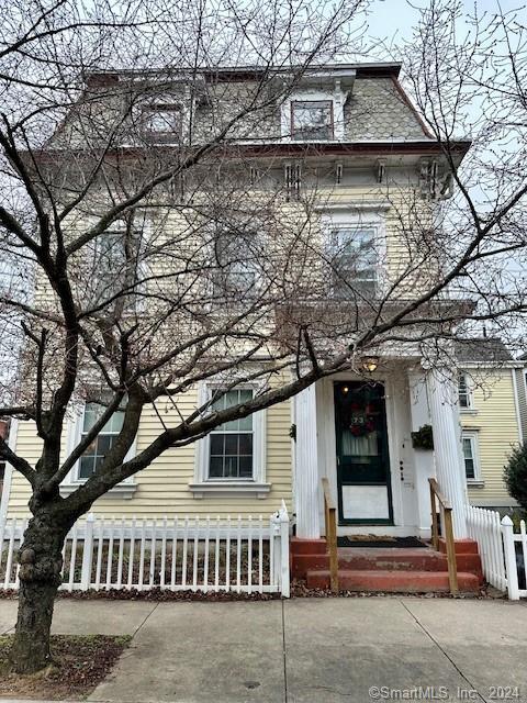 73 Lyon Street, Unit 3 New Haven, CT 06511 - Photo 5 of 5 a roof deck with table and chairs under an umbrella