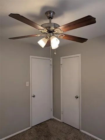 a view of a chandelier fan in a small space