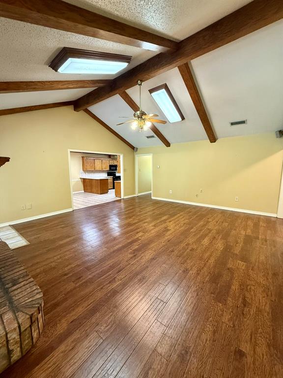 11535 Timber Ridge Drive Keithville, LA 71047 - Photo 8 of 39 a view of an empty room with wooden floor