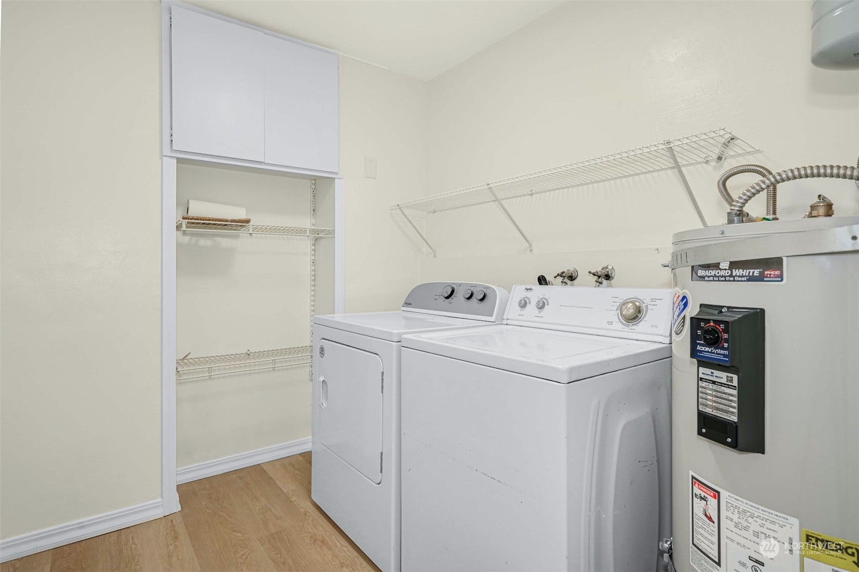 2223 Northeast 8th Place Renton, WA 98056 - Photo 18 of 32 a utility room with cabinets washer and dryer