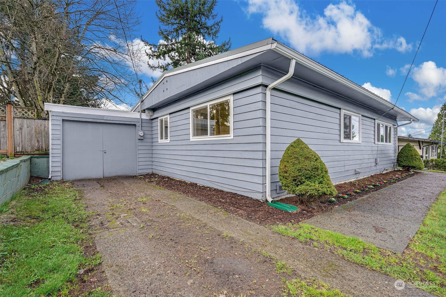 2223 Northeast 8th Place Renton, WA 98056 - Photo 20 of 32 a backyard of a house with lots of green space