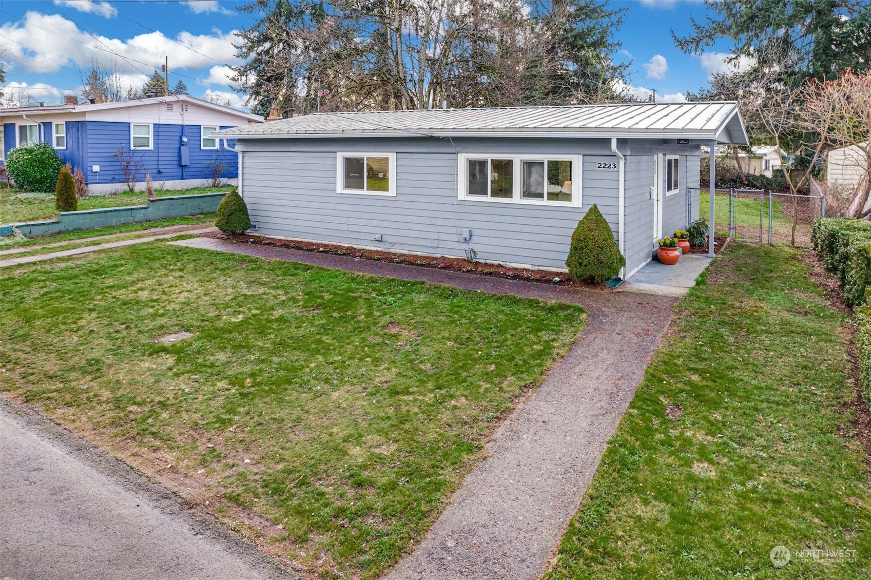2223 Northeast 8th Place Renton, WA 98056 - Photo 27 of 32 a front view of a house with a garden