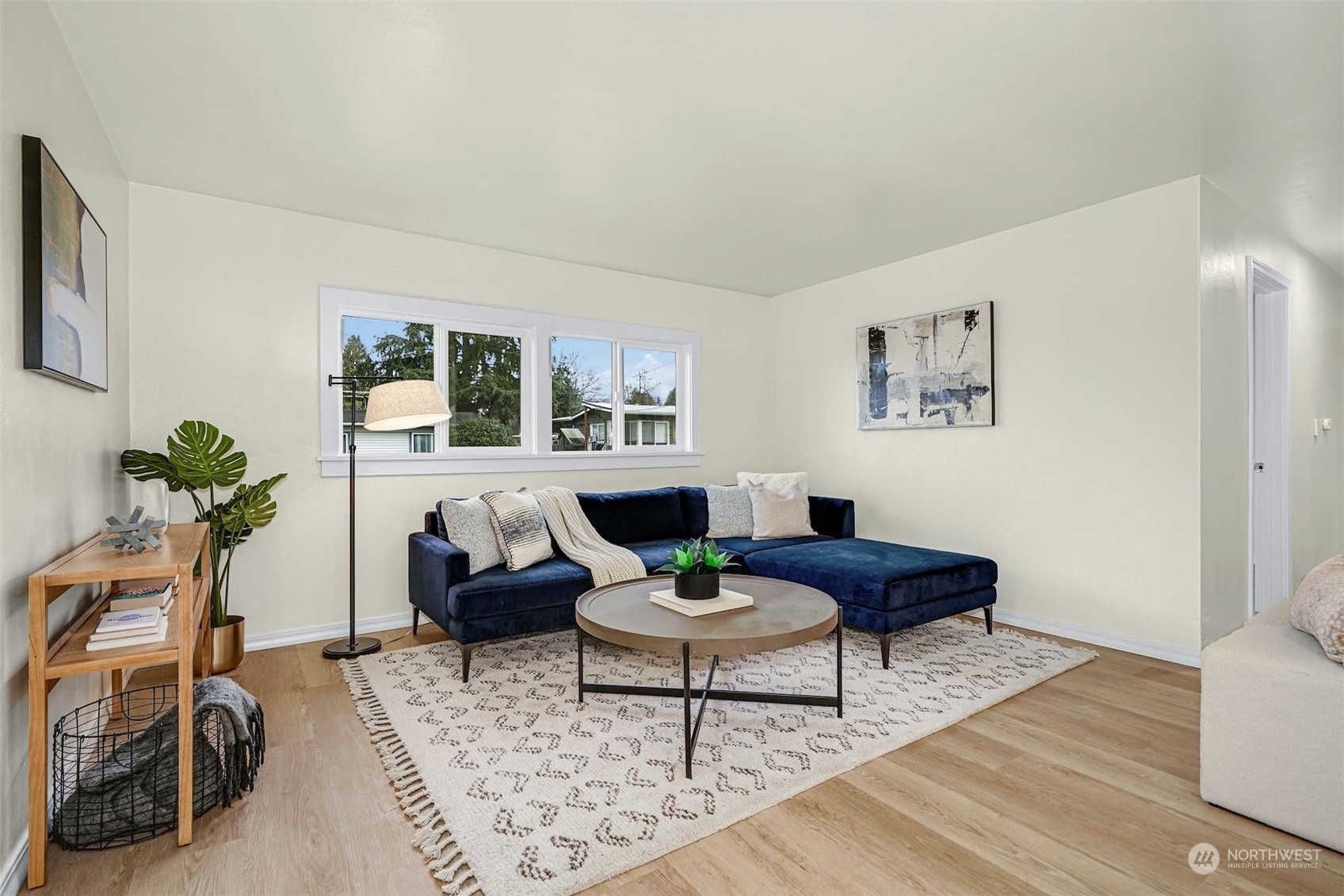 2223 Northeast 8th Place Renton, WA 98056 - Photo 5 of 32 a living room with furniture a table and a potted plant