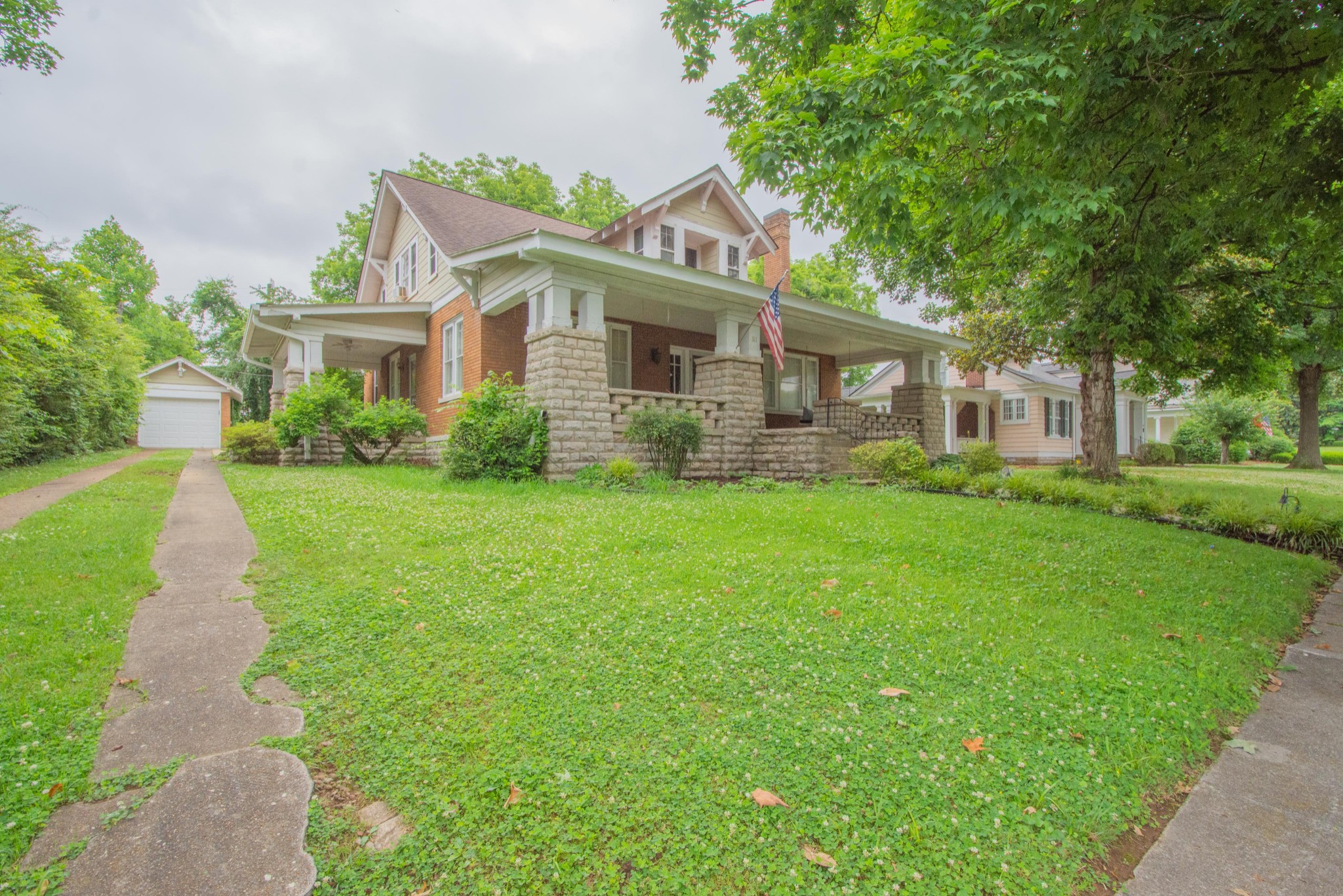 311 South 3rd Street Pulaski, TN 38478 - Photo 34 of 44 a front view of a house with a yard and trees