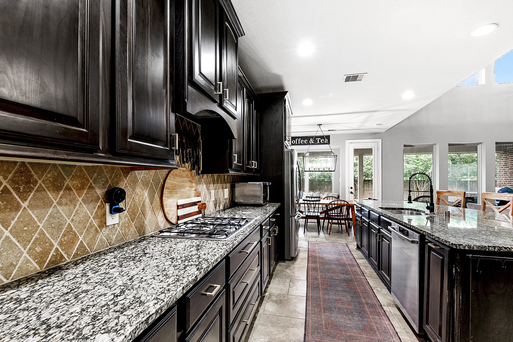 2939 Bobby Jones Road Katy, TX 77494 - Photo 18 of 50 a kitchen with granite countertop lots of counter top space and stainless steel appliances