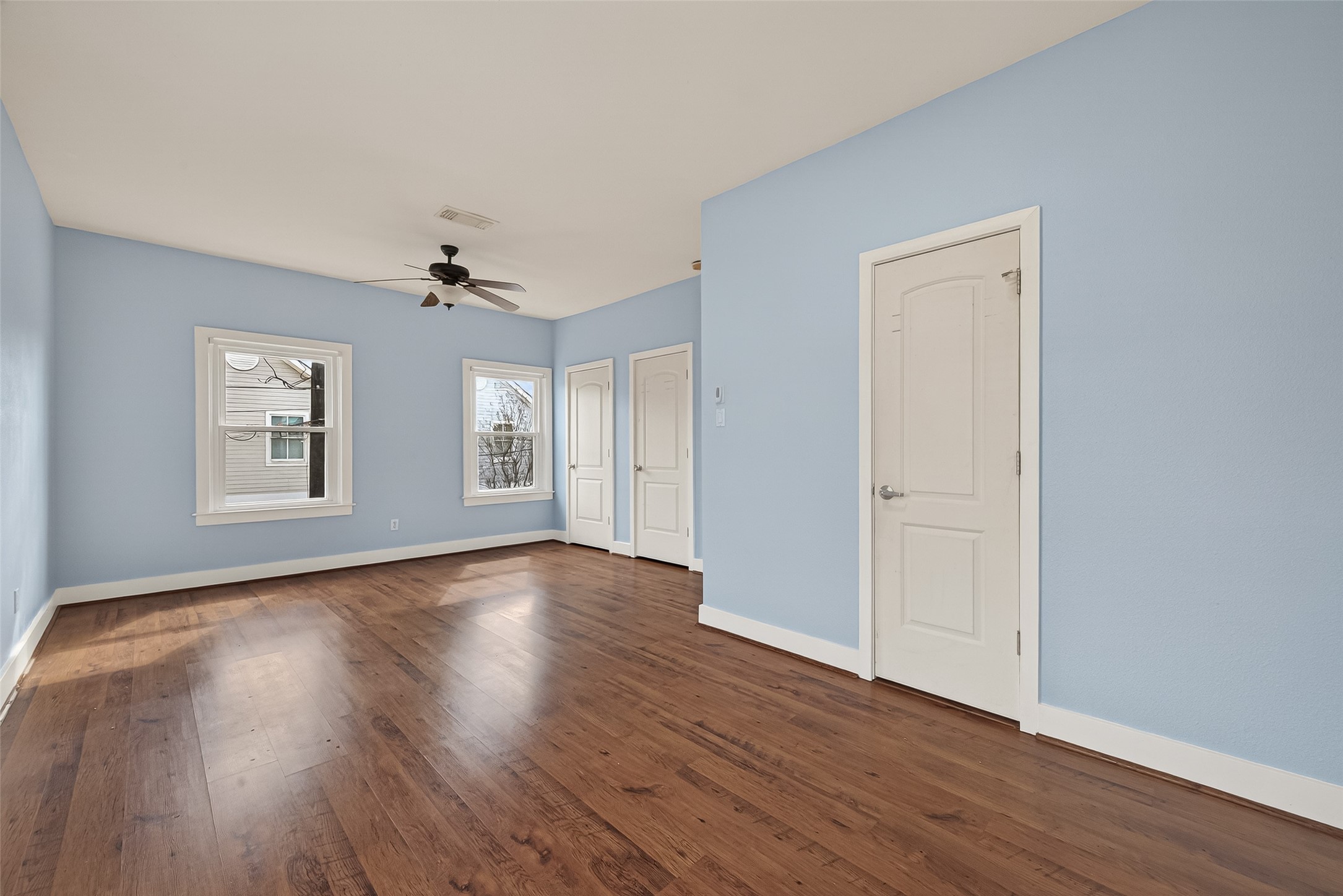 1620 Andrews Street Houston, TX 77019 - Photo 11 of 12 a view of an empty room with wooden floor and a window