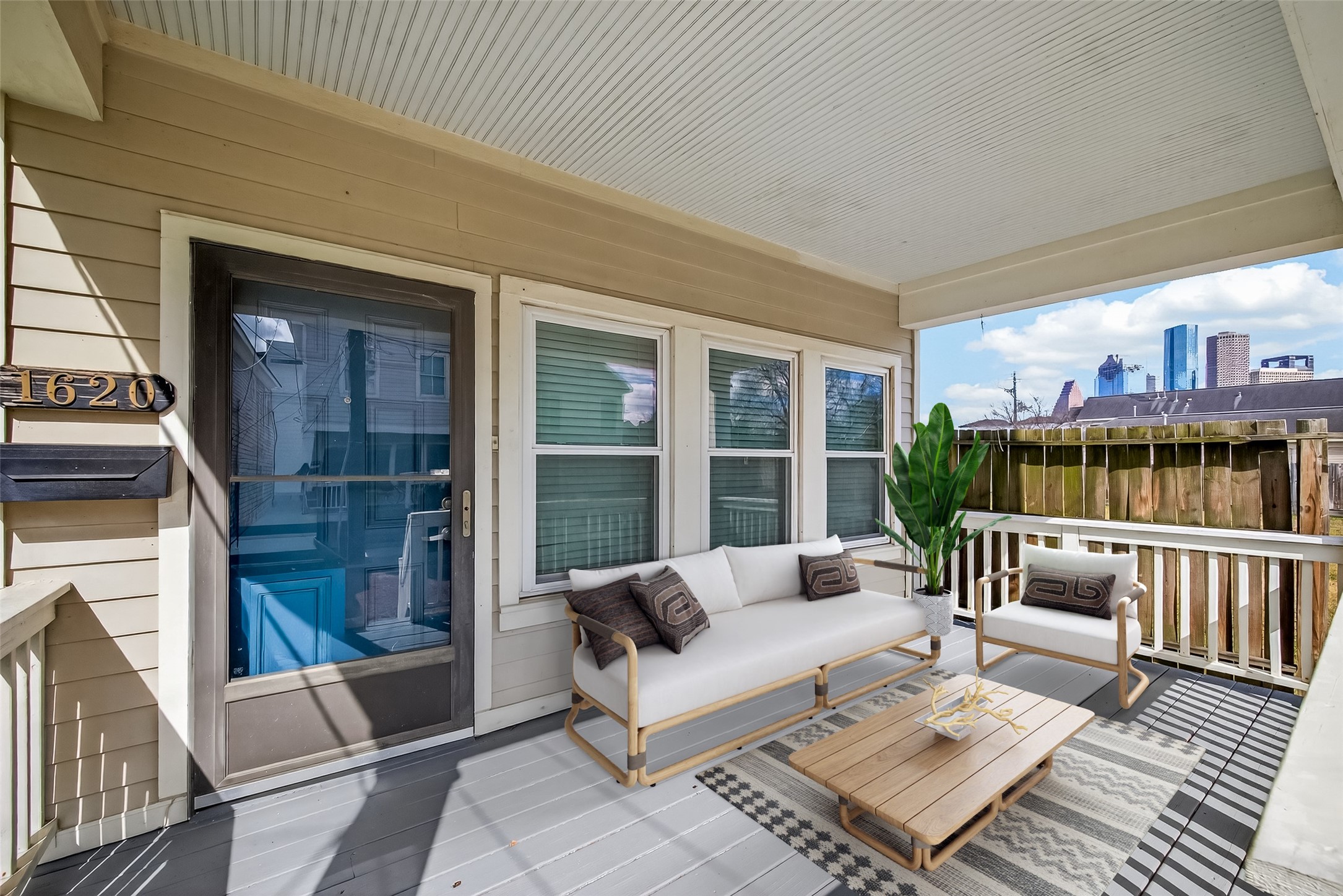 1620 Andrews Street Houston, TX 77019 - Photo 2 of 12 a balcony with furniture and a potted plant