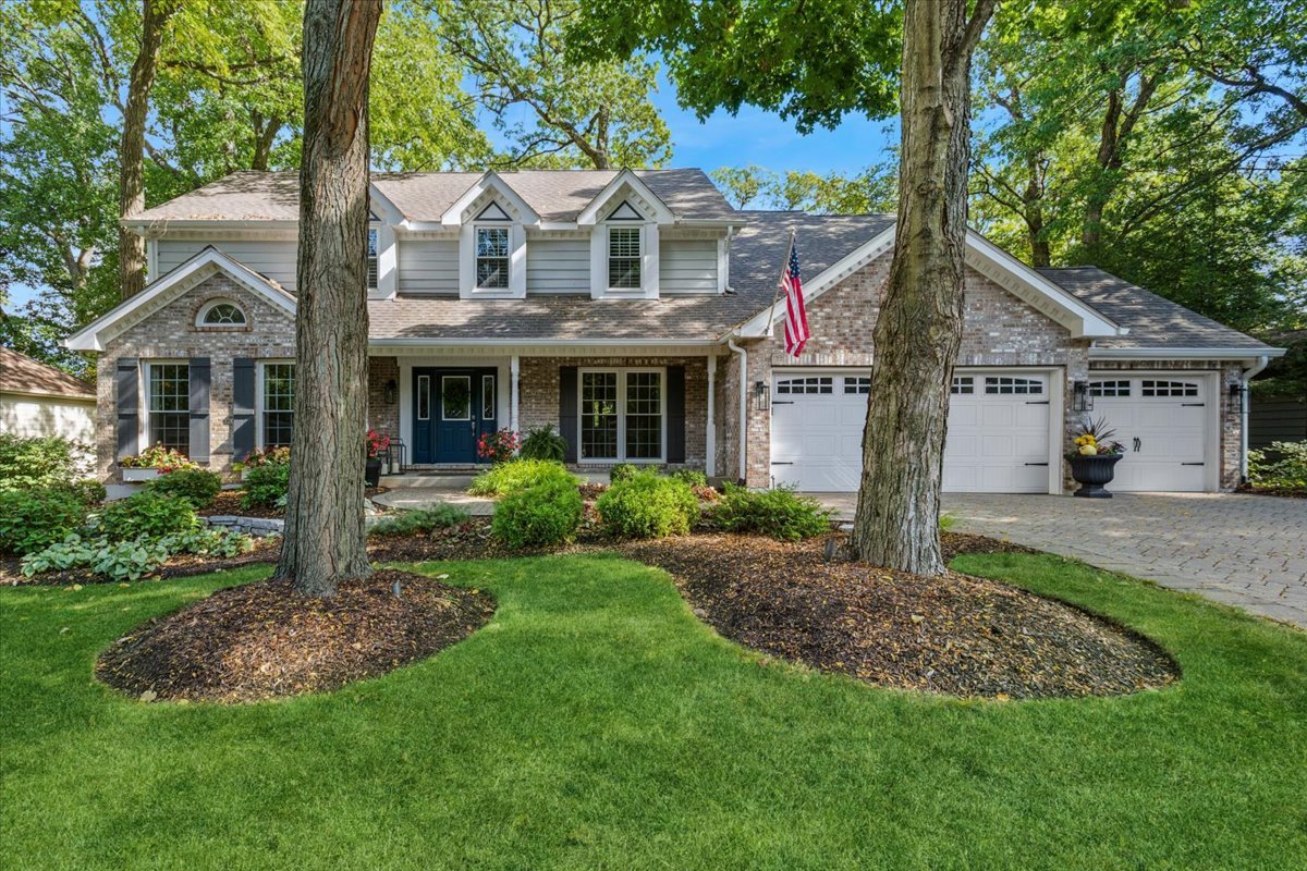2250 Lisson Road Naperville, IL 60565 - Photo 1 of 53 a view of a white house next to a yard with big trees