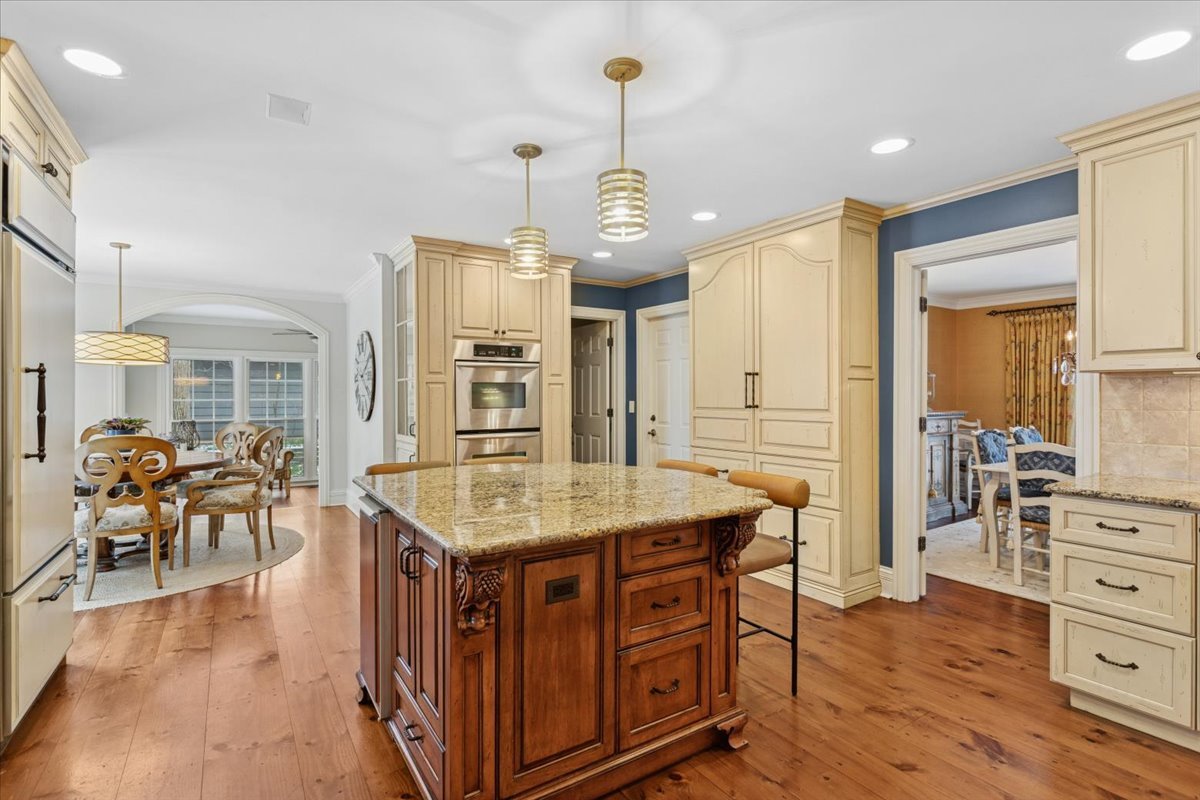 2250 Lisson Road Naperville, IL 60565 - Photo 13 of 53 an open kitchen with a table and chairs in it