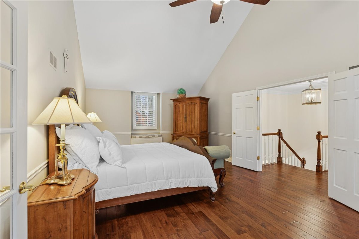 2250 Lisson Road Naperville, IL 60565 - Photo 26 of 53 a bedroom with a bed and wooden floor